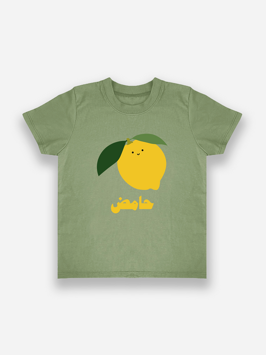 Green t-shirt with a lemon graphic and arabic text on a white background