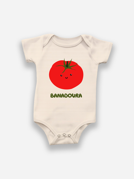 Baby onesie with a tomato design and 'BANADOURA' text on a white background