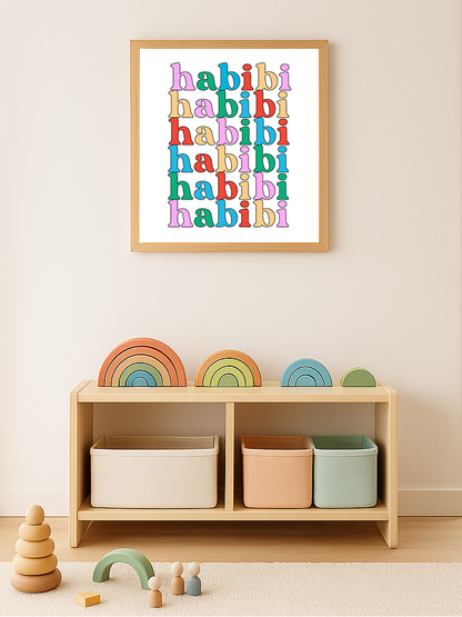 Framed artwork with 'habibi' text in colorful letters above a shelf with storage bins and toys.