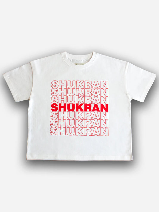 White Shukran kids tee with red lettering